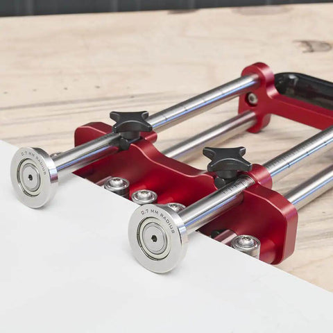 Two Station Metal Bender Pro Grade For Precise Bends Under 150mm, Adjustable Roller Spacing From 0.5mm To 1mm on wooden surface