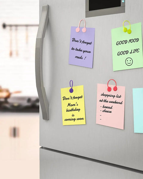 Magnetic Cable Ties 10 Pack Reusable Cable Organizers For Earbuds And Cords on fridge holding notes in various colors