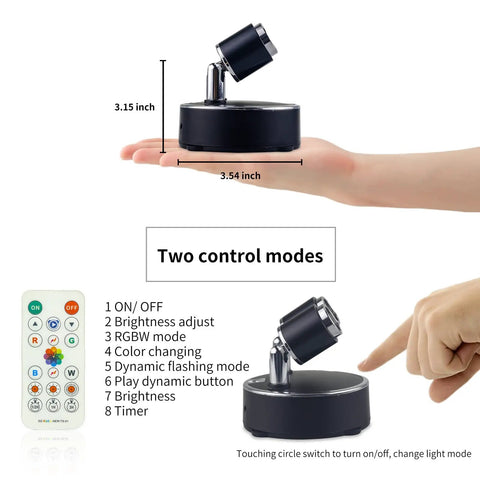 LED Spotlight Battery Operated Light With Remote Control Dimmable Mini Accent Lighting shown with remote control and hand for size.
