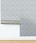 Upgrade Your Interior Game With This Rad Boho Ikat Soft Silver Metallic Wallpaper Featuring A Chic Fibrous Finish That Adds Major Bling To Any Walls, showing the silver and blue pattern in a home setting.