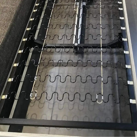 Upgrade Your Dated Living Room Setup With These Badass Upholstery Springs And Z Clips For Couch Chair Restoration Fixes Wobbly Seating Smooth And No Sweat Guaranteed To Hold Tight Forever - Close-up of steel springs and clips in a couch frame.