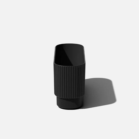 Front view of a Long Planter For Porch Patio And Backyard In Durable Plastic Stone Composite Fluted All Weather Outdoor Pot For Shrubs And Flowers Modern Decor With Scratch And UV Resistant Finish