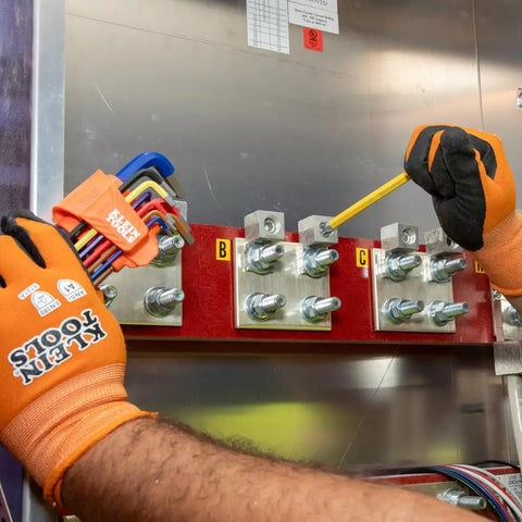 Person using Long Ball End Hex Key Wrench Set With SAE And Metric, L Style, Color Coded Powder Coat in electrical panel repair