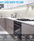 Modern kitchen with Motion Activated LED Strip Lights 65.6 Ft Rope Light With Day And Night Modes illuminating under cabinets.