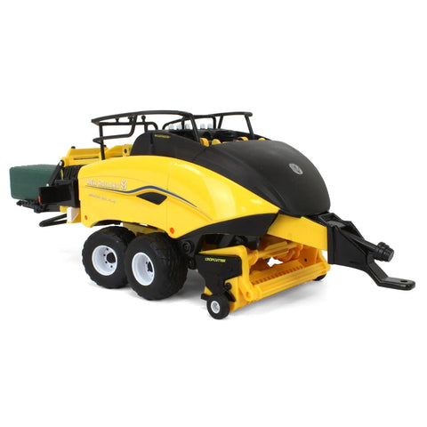 1/32 Scale New Holland Big Baler 340 Plus Diecast Model with six square bales and free rolling wheels, side view.