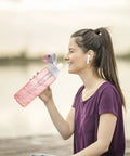 Woman sipping from bottle with Replacement Mouthpiece Kit For Water Bottles Compatible With Insulated Filtered Water Bottles Includes 3 Silicone Mouthpieces And 4 Filter Cartridges Easy Swap Bottle Parts Upgrade Food Grade Silicone.
