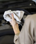 Person using Bar Mop Towels Value Pack Of 60, 14 By 17 Inches, Absorbent And Durable Multipurpose Cleaning Rags on car engine.