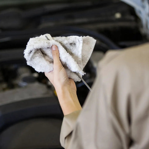 Person using Bar Mop Towels Value Pack Of 60, 14 By 17 Inches, Absorbent And Durable Multipurpose Cleaning Rags on car engine.