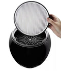 HEPA filter being placed into Compact Small Room HEPA Type Air Purifier With 360 Degree Intake For Up To 112 Sq Ft Black Finish