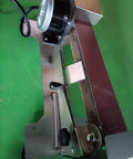 Knockout 600W Electric Knife Sharpener With Water Cooled Belt Sander And Variable Speed Wet Dry Grinder Featuring Polishing Wheel close-up view of belt and motor.