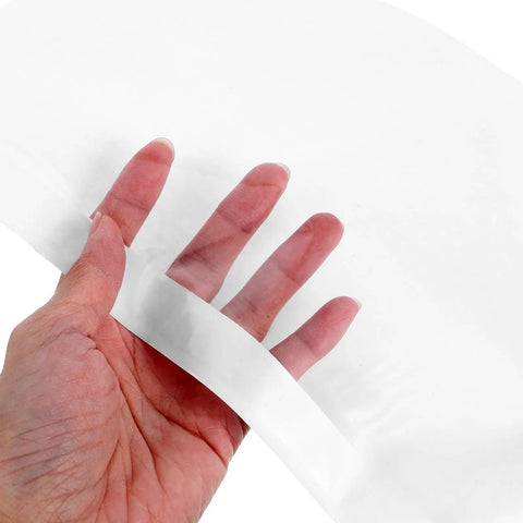Hand holding 100 Count White Self Adhesive Packing List Envelopes With Large Capacity For Mailing And Packing Documents Versatile Shipping