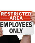 Restricted Area Employees Only Aluminum Sign 7 By 10 Inches Weatherproof Heavy Duty 40 Mil Rust Free Outdoor Sign With Rounded Corners And Safe Handling held by hands