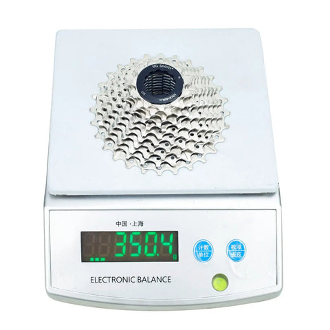 Beefed Up 11 Speed Bicycle Cassette on scale, weighing 350.4g, nickel-plated steel cogs for mountain and road bikes.