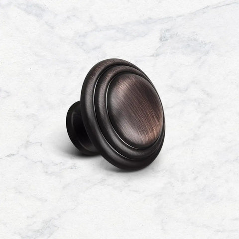 Oil Rubbed Bronze Cabinet Knob Set 5 Pack 1-3/8 Inch Round Knobs With 1 Inch Screws For Kitchen Cabinets Wardrobe Dressers Drawers And Closets Durable Finish Easy To Install Go-To Upgrade For Your Kitchen showing a single knob on white background