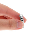 Hand holding durable practice fencing tip replacement for realistic drills, precise fit with fencing gear, chrome finish.