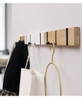 Wall Mounted Nailless Folding Coat Hook Set Featuring Twin Bar Design for Hallway Closet Entryway Zero Drilling Installation with bags.