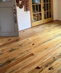 Ponderosa Premium Interior Wood Aging Stain 5 Gallon Container applied to floor, showcasing warm honeyed brown finish and natural grain.