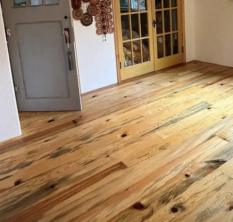 Ponderosa Premium Interior Wood Aging Stain 5 Gallon Container applied to floor, showcasing warm honeyed brown finish and natural grain.