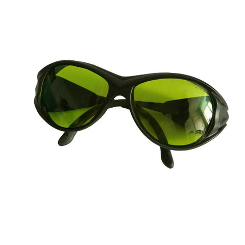 Next Level IPL Laser Protection Glasses And OD5 Plus Safety Goggles With UV400 Shielding shown at an angle, featuring green lenses.