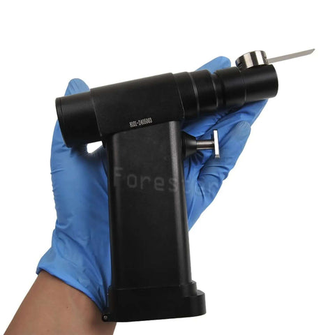 Handheld Knockout Veterinary Orthopedic Mini Bone Saw With Micro Oscillating Drill for precise animal surgeries in gloved hand.
