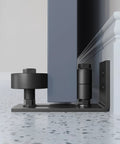 Sliding Barn Door Bottom Floor Guide,Adjustable Roller,Wall Mount System,Flush Flat Bottom Design,8 Assemble Setup Options,Black close-up installed view