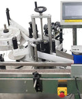 Straight Up Reliable Automatic Round Bottle Labeling Machine With Slick Touch Screen Interface No Sweat Commercial Setup For Beer Containers Built Tough 10 To 180 Mm Height Range, top view showing adjustable height and label dispenser.