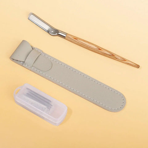 Get Your Brows In Tip Top Shape With This Manual Eyebrow Shaper Trimmer Featuring A Wooden Handle And Safety Mesh Guard For Dead On Facial Hair Removal For Men And Women Plus Stainless Steel Refills, showcasing the trimmer, case, and blades.