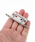 Hand holding Nickel Plated Cabinet Butt Hinges Set, 16 Pcs, 2 Inch Flush Mount Metal Hardware