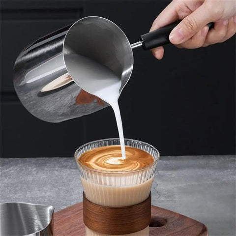Pouring milk from Stainless Steel Turkish Coffee Pot And Moka Style Saucepan For Brewing Coffee Melting Chocolate Heating Milk And Sauces 350Ml 600Ml 900Ml With Pouring Spout Durable Kitchen Vessel For Everyday Kitchen Hustle