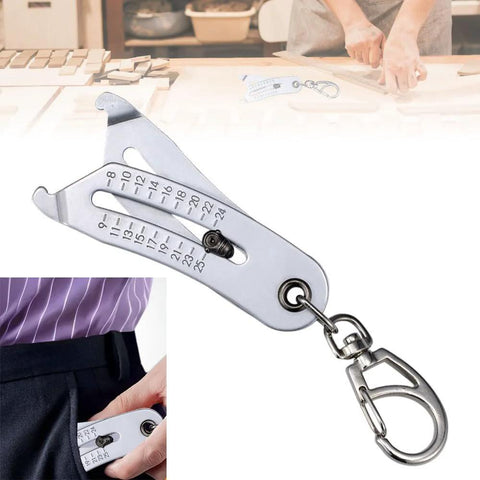 Front view of a metal bolt-size finder keychain with dual metric/imperial scales and a metal clip.