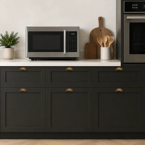 Three Pack Antique Brass Half Moon Cup Pulls For Kitchen Cabinets And Drawers Featuring Hella Smooth Finishes and Rock Solid Zinc Alloy Build on dark cabinetry.