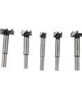 Heavy Duty Forstner Drill Bit Set 15 To 35 Millimeters With Dead Center Tip for wood drilling, showing five bits of varying sizes.
