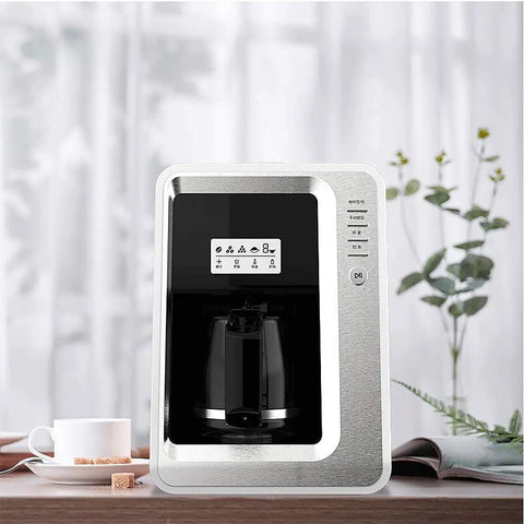 Fully Automatic Bean To Cup Coffee Maker With Built In Grinder Removable Reservoir And Smart Thermal Insulation on countertop with cup.