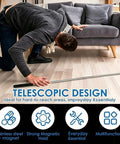 Person using Eight Pack Telescoping Magnetic Pickup Tools With 1.5, 3, 10, And 15 Lb Capacity to retrieve item under couch.