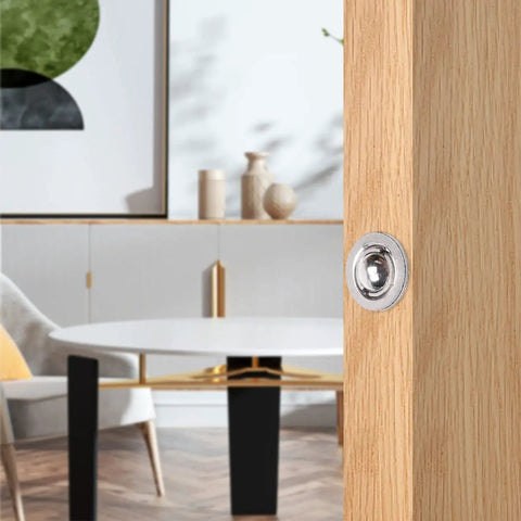 Close-up of Heavy Duty Adjustable Door Ball Catch Set in Brushed Nickel installed on wooden door, showing ball catch