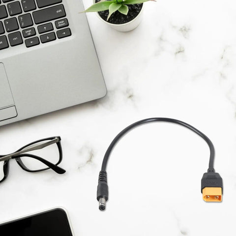 Male to DC5.5x2.1mm or 2.5mm 5A Charging Cable 20AWG Heavy Duty Power Lead on marble desk next to laptop and glasses