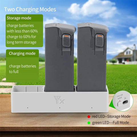 Two grey batteries in Three-Battery Drone Charging Hub For Avata 2, Two-Way USB Charger With Sequential Charging visible outdoors