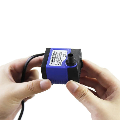 Person holding Two Pack Mini Fountain Pump 80GPH Submersible Water Pump For Aquarium Fish Tank Outdoor Water Feature Hydroponics Pond