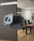 Black nylon furniture caster set with mounting plate shown in office setting