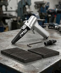 Top Shelf Pneumatic Air Belt Sander With A Ridiculously Fast 10 Mm Track And Hog Wild 16000 Rpm Motor on a workbench with metal pieces.