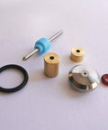 Waterjet on/off valve repair kit parts: blue plunger with metal rod, brass bushings, stainless disc, black O-ring, red seal.