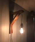 Premium Black Metal Wire Cage Lamp Guard For Ceiling Fans And Pendant Lights Killer Diamond Shape Light Cover With Slick Rust Resistant Coating Set Of Two mounted on wooden wall sconce.