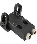 Kick Your DIY Woodworking To The Next Level With This Sweet 15 Degree Wood Punch Locator Tool For Perfect Angled Dowel Holes And Super Strong Joints Made From Durable Aluminum Alloy With Six Drill Sleeves Included. Black aluminum locator with measurement markings and two drill sleeves.