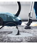 Round Floor Box Cover Kit Nonmetallic With Two Lift Lids for Hubbell Raco 5511 Floor Box in use, showing gray cover on carpet.