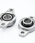 Two Pcs KFL004 20mm Pillow Block Bearings Built Tough With Solid Zinc Alloy Housing Plus Chrome Steel Bore Self Aligning Assembly Handles Shaft Offset With Ease on white background