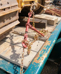 Heavy-Duty Grade 70 Transport Chain And Binder Kit with Four Three-Eighths Inch by Twenty-Foot Chains securing cargo on a truck
