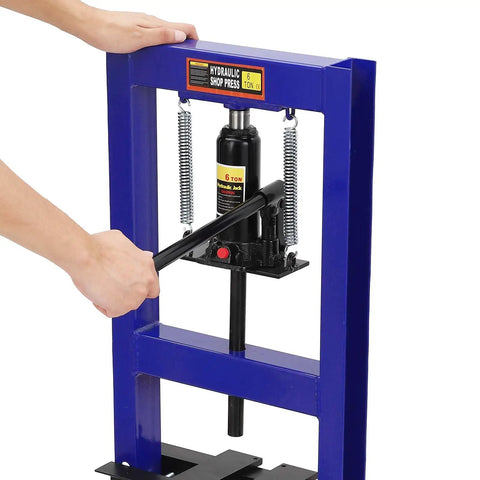Person operating 6 Ton H Frame Shop Hydraulic Press With Two Press Plates Heavy Duty Garage Ready Auto Repair Machine Adjustable Pressure