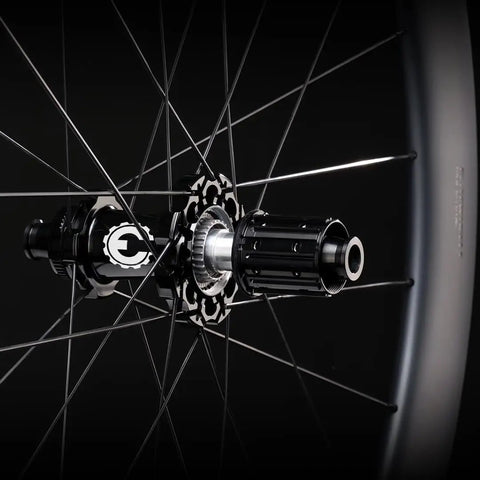 Close-up of 50T ceramic bearing hub in road wheelset with Aero Plus wing spokes and ratchet system for fast and smooth ride.