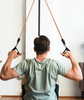 Man using Premium Space Saver Gym Mount With One Steel Rail And One Quick Slide Car for elastic resistance tubing bands.