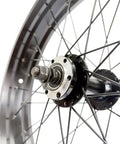 Close-up of Beefy Fat Bike Front Wheel 20x4.0 With Double Wall Alloy Rim 135mm Bolt-On Hub 36x13G spokes and hub detail